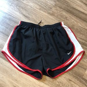 Nike running shorts in black, white, and red